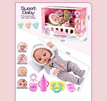 Пупс WD 2326 AB 2 види, висота 27 см, звукові ефекти, сміх та плач, п’є, ходить на горщик, заплющує очі, посуд, пляшечка, подушка, в коробці